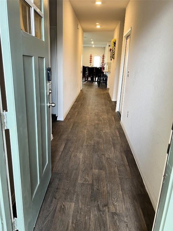 201 Abby Rd, Georgetown, TX 78626 - hall featuring dark wood-style flooring and baseboards