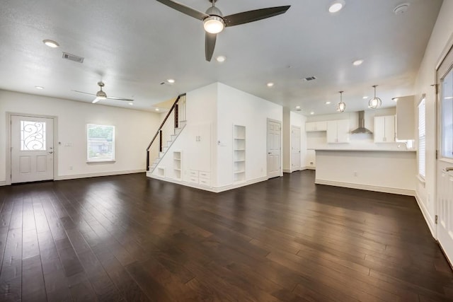 2105 Tiger Trl Unit 302, Round Rock, TX 78665 - unfurnished living room featuring a ceiling fan, dark wood-style floors, baseboards, stairway, and recessed lighting