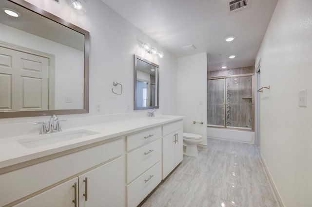 2105 Tiger Trl Unit 302, Round Rock, TX 78665 - full bath featuring toilet, double vanity, enclosed tub / shower combo, wood finished floors, and baseboards