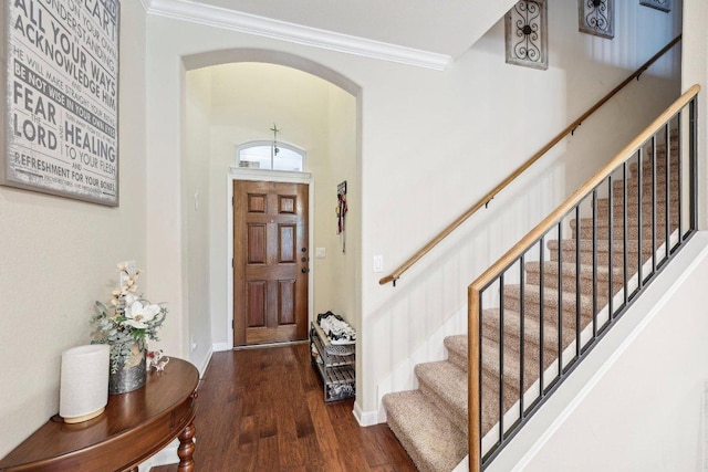 13400 Briarwick Dr Unit 1202, Austin, TX 78729 - entryway with ornamental molding, arched walkways, wood finished floors, stairs, and baseboards