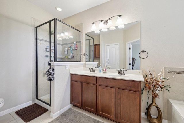 13400 Briarwick Dr Unit 1202, Austin, TX 78729 - bathroom featuring a shower stall, tile patterned flooring, double vanity, and toilet