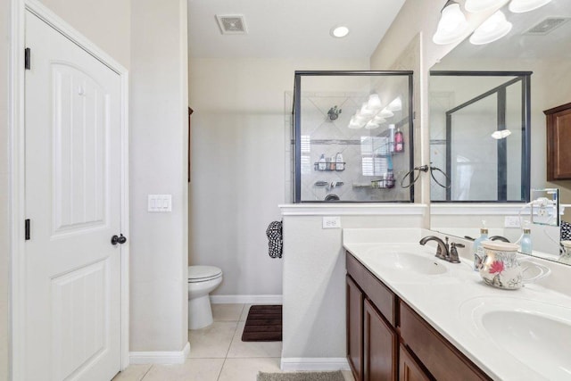 13400 Briarwick Dr Unit 1202, Austin, TX 78729 - bathroom featuring double vanity, tile patterned floors, toilet, a shower stall, and baseboards