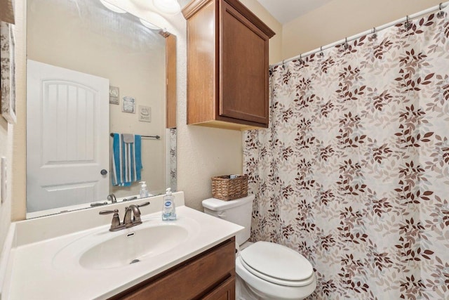 13400 Briarwick Dr Unit 1202, Austin, TX 78729 - bathroom with vanity, toilet, and a shower with shower curtain