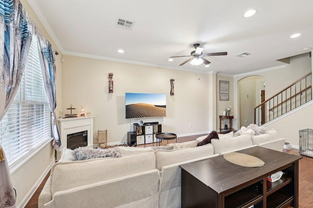13400 Briarwick Dr Unit 1202, Austin, TX 78729 - living room featuring arched walkways, baseboards, ceiling fan, recessed lighting, and wood finished floors