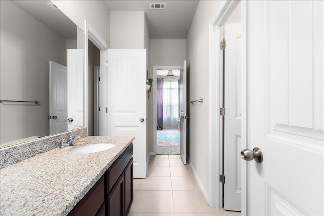 211 Joseph Dr, Buda, TX 78610 - bathroom featuring vanity, tile patterned floors, and baseboards