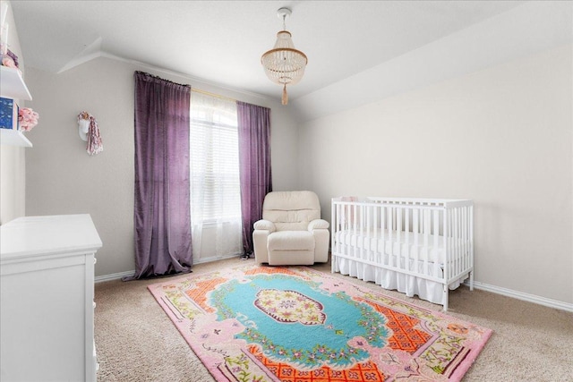 211 Joseph Dr, Buda, TX 78610 - bedroom with carpet flooring, vaulted ceiling, a crib, and baseboards