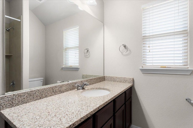 211 Joseph Dr, Buda, TX 78610 - full bathroom featuring vanity, toilet, and a shower