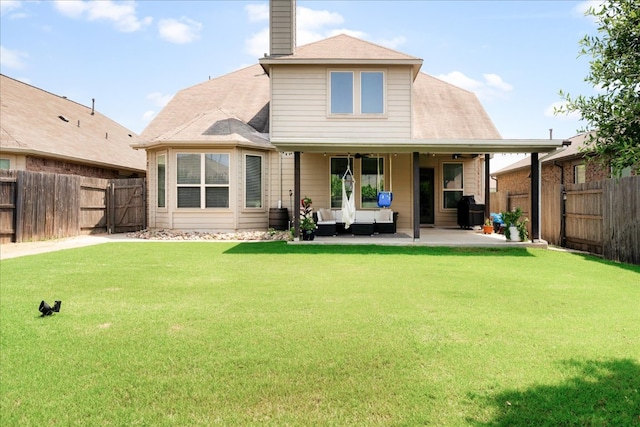 211 Joseph Dr, Buda, TX 78610 - back of property featuring a patio area, a chimney, and outdoor lounge area