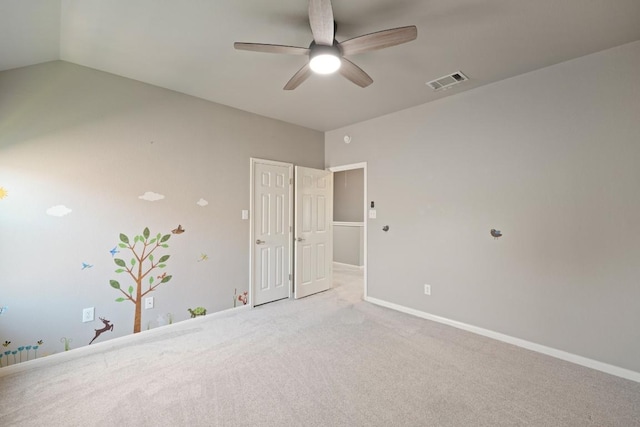 1121 Boxwood Loop, Georgetown, TX 78628 - unfurnished bedroom featuring carpet flooring, lofted ceiling, and ceiling fan