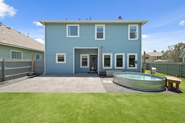 1121 Boxwood Loop, Georgetown, TX 78628 - back of house featuring a fenced backyard, a patio area, and a chimney