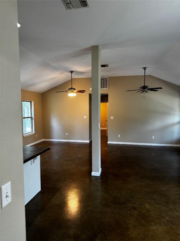 106 Shetland Ln, Bastrop, TX 78602 - unfurnished living room featuring ceiling fan, lofted ceiling, and baseboards