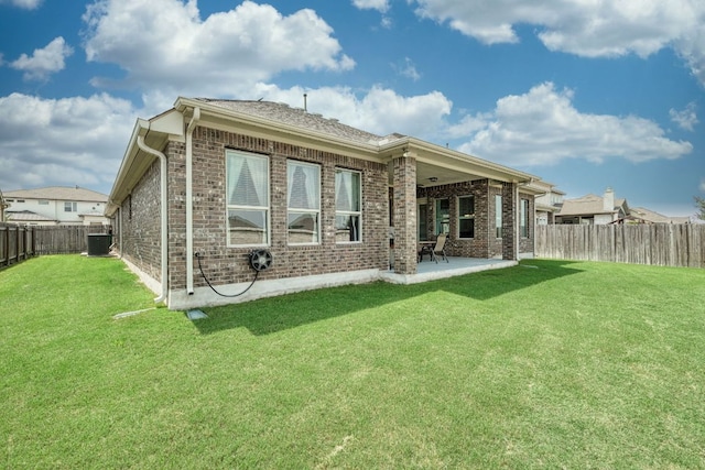 19500 Chayton Cir, Pflugerville, TX 78660 - rear view of property with brick siding, a patio, and central AC
