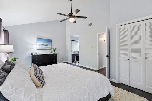 8115 Raintree Pl, Austin, TX 78759 - bedroom with dark wood-type flooring, high vaulted ceiling, baseboards, a closet, and ensuite bathroom