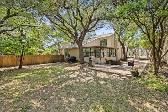 8115 Raintree Pl, Austin, TX 78759 - view of yard featuring a sunroom, a patio, and an outdoor hangout area
