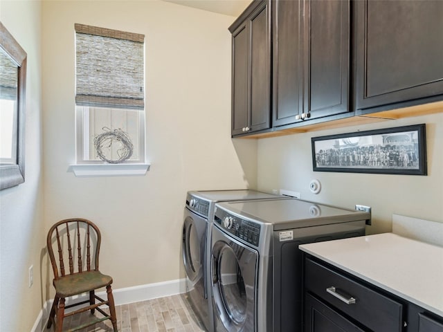 121 Wild Honeysuckle Way, San Marcos, TX 78666 - washroom with cabinet space, washing machine and clothes dryer, and light wood-style floors