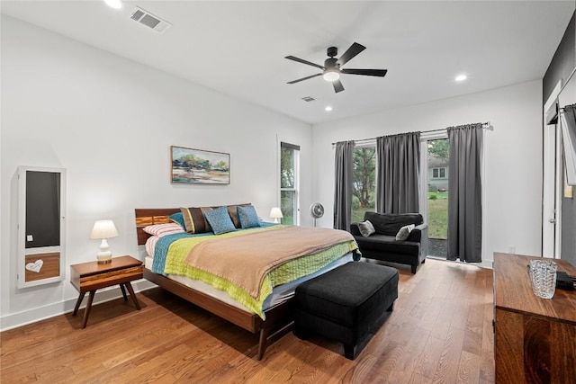 22005 Briarcliff Dr, Spicewood, TX 78669 - bedroom with light wood finished floors, recessed lighting, a ceiling fan, and access to outside