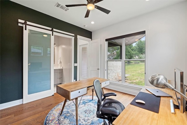 22005 Briarcliff Dr, Spicewood, TX 78669 - office area with a ceiling fan, wood finished floors, recessed lighting, and baseboards