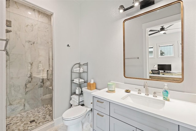 22005 Briarcliff Dr, Spicewood, TX 78669 - full bath featuring toilet, a marble finish shower, vanity, and ceiling fan
