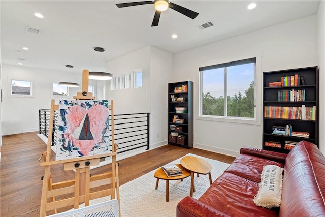 22005 Briarcliff Dr, Spicewood, TX 78669 - living room featuring plenty of natural light, wood finished floors, ceiling fan, and recessed lighting