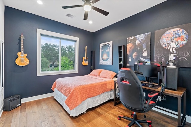 22005 Briarcliff Dr, Spicewood, TX 78669 - bedroom featuring a desk, wood finished floors, baseboards, recessed lighting, and ceiling fan