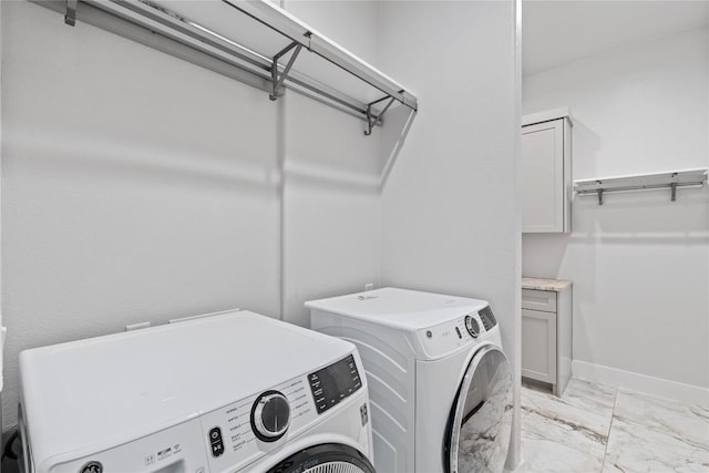 22005 Briarcliff Dr, Spicewood, TX 78669 - washroom with independent washer and dryer, light marble finish flooring, and baseboards