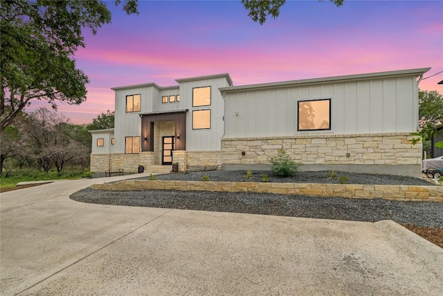 22005 Briarcliff Dr, Spicewood, TX 78669 - contemporary home with stone siding and board and batten siding