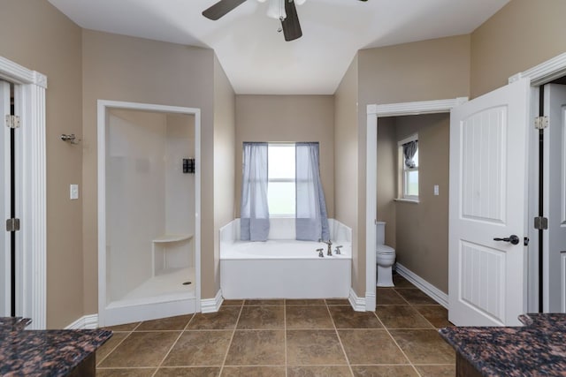 12011 Fm 1150th Rd, Luling, TX 78648 - bathroom with a garden tub, toilet, a ceiling fan, baseboards, and a shower