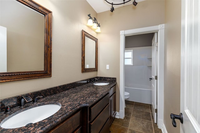 12011 Fm 1150th Rd, Luling, TX 78648 - bathroom with double vanity and toilet