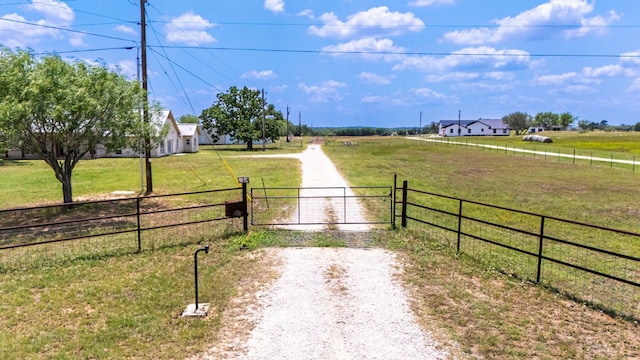 12011 Fm 1150th Rd, Luling, TX 78648 - view of dirt / gravel road featuring a view of countryside and a gate