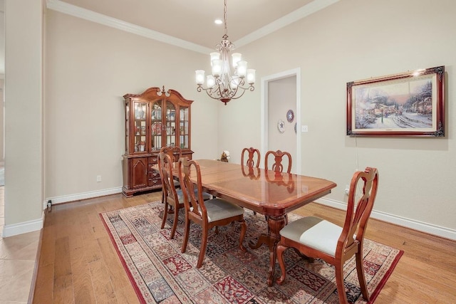 1617 High Lonesome, Leander, TX 78641 - dining area with a chandelier, ornamental molding, light wood finished floors, and baseboards