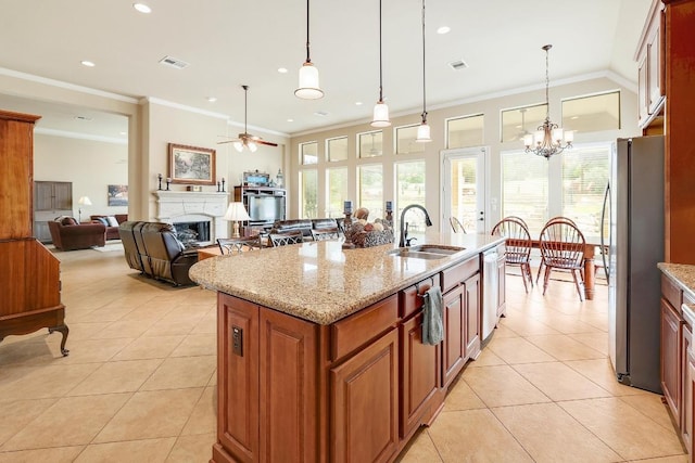 1617 High Lonesome, Leander, TX 78641 - kitchen featuring a sink, stainless steel appliances, light tile patterned flooring, a fireplace, and a ceiling fan