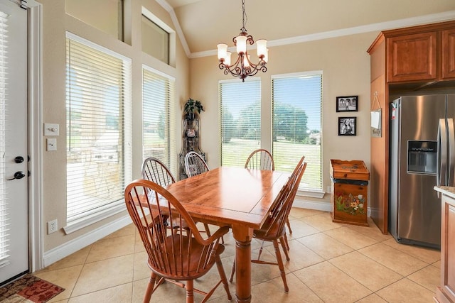 1617 High Lonesome, Leander, TX 78641 - dining area featuring light tile patterned flooring, crown molding, a chandelier, baseboards, and healthy amount of natural light