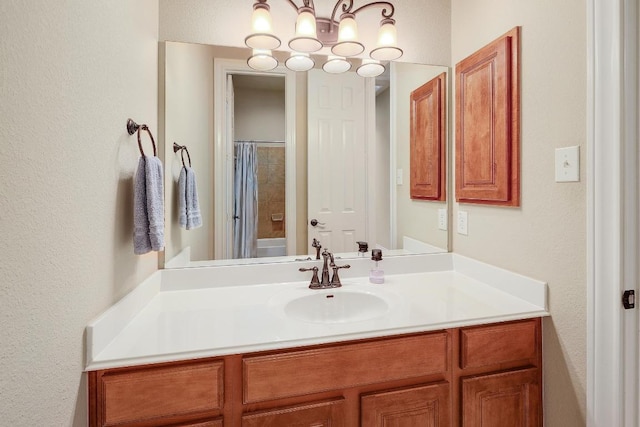 1617 High Lonesome, Leander, TX 78641 - full bath with vanity, a textured wall, a shower with shower curtain, and a chandelier