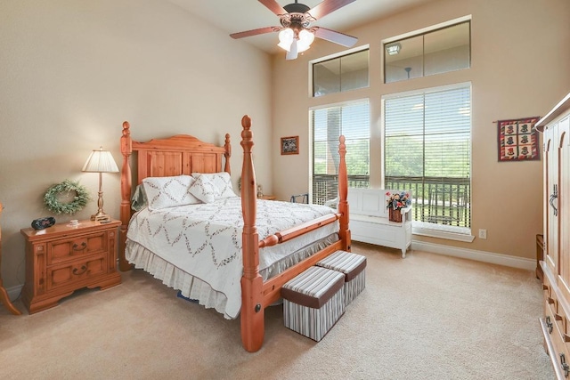 1617 High Lonesome, Leander, TX 78641 - bedroom featuring light colored carpet, baseboards, a ceiling fan, and a high ceiling