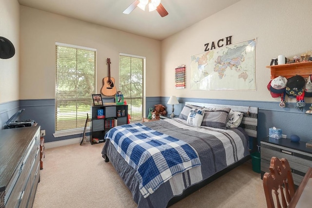 1617 High Lonesome, Leander, TX 78641 - bedroom featuring light carpet, a wainscoted wall, and a ceiling fan