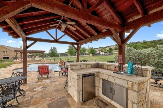 1617 High Lonesome, Leander, TX 78641 - view of patio / terrace with a gazebo, a sink, an outdoor kitchen, and ceiling fan