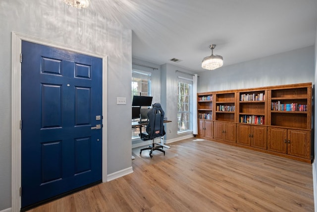 19402 Gale Meadow Dr, Pflugerville, TX 78660 - home office featuring light wood-style floors and baseboards