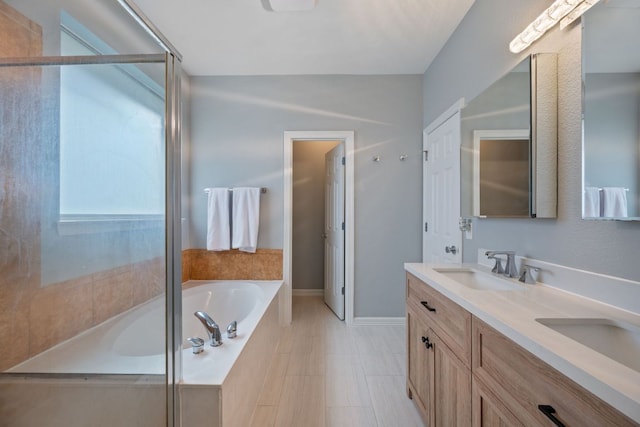 19402 Gale Meadow Dr, Pflugerville, TX 78660 - bathroom with a garden tub, double vanity, an enclosed shower, and baseboards