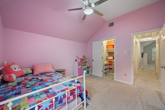 19402 Gale Meadow Dr, Pflugerville, TX 78660 - bedroom featuring vaulted ceiling, light colored carpet, baseboards, a ceiling fan, and a walk in closet