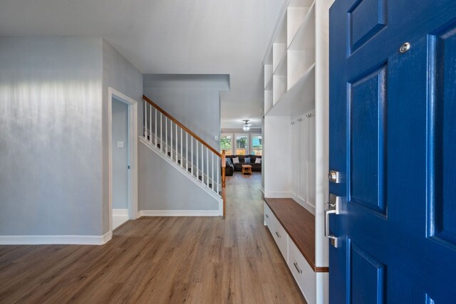 19402 Gale Meadow Dr, Pflugerville, TX 78660 - foyer entrance with wood finished floors, stairway, and baseboards