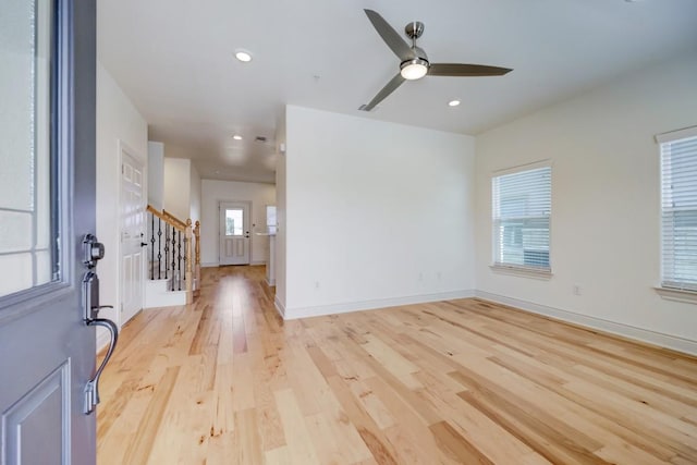 2105 Tiger Trl Unit 303, Round Rock, TX 78665 - unfurnished room with a ceiling fan, light wood-style flooring, stairway, recessed lighting, and baseboards