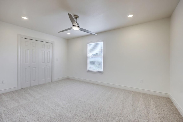 2105 Tiger Trl Unit 303, Round Rock, TX 78665 - unfurnished bedroom with recessed lighting, light carpet, baseboards, a closet, and a ceiling fan