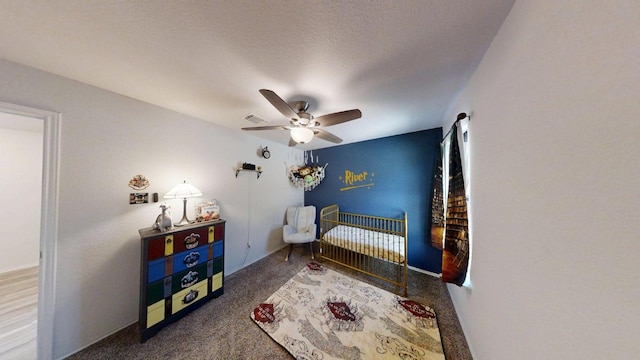 183 Beth Ann Loop, Taylor, TX 76574 - carpeted bedroom with a crib and ceiling fan