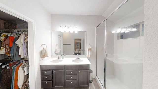 183 Beth Ann Loop, Taylor, TX 76574 - full bath featuring double vanity, a shower stall, and a spacious closet