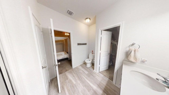 183 Beth Ann Loop, Taylor, TX 76574 - bathroom featuring wood finished floors and vanity