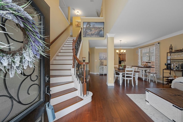 1504 Edelweiss Dr, Cedar Park, TX 78613 - foyer featuring a chandelier, stairs, ornamental molding, baseboards, and wood finished floors