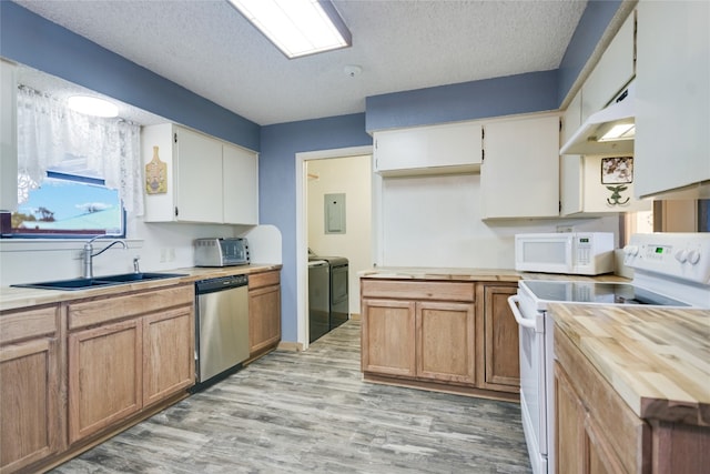 838 Pine Ln, Cottonwood Shores, TX 78657 - kitchen with white appliances, a sink, separate washer and dryer, butcher block counters, and light wood finished floors
