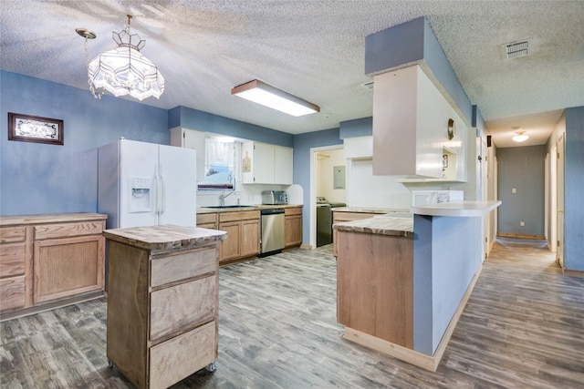 838 Pine Ln, Cottonwood Shores, TX 78657 - kitchen featuring dishwasher, white fridge with ice dispenser, wood finished floors, and a textured ceiling