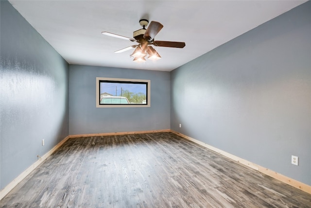 838 Pine Ln, Cottonwood Shores, TX 78657 - spare room with wood finished floors, a ceiling fan, and baseboards