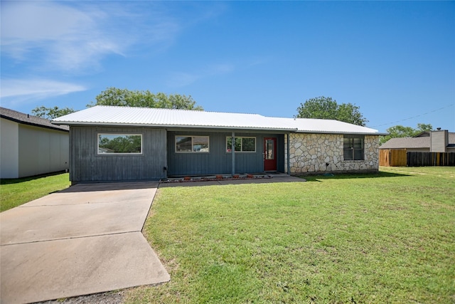 838 Pine Ln, Cottonwood Shores, TX 78657 - ranch-style home featuring a front yard, metal roof, stone siding, and board and batten siding